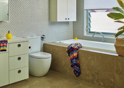 Breezway louvres above bathtub to ventilate bathroom