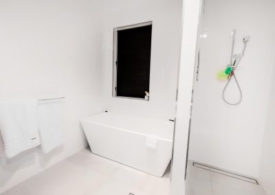 Breezway louvres behind bath tub
