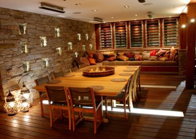 Dining room with multiple banks of Breezway louvres on back wall