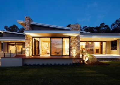 Night time exterior of home with Breezway