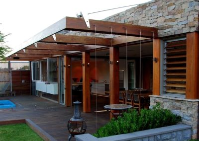 External view of outdoor deck with single bay of timber louvres on right