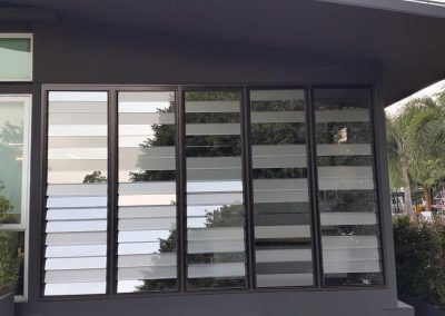 Mix glass louvre blades provide decorative affect at Thai Aust Office