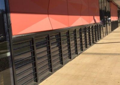 Multiple Breezway Louvres with Security Bars in Carnes Hill Community Centre