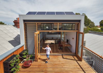 Outdoor deck with single bay of Breezway louvres next to bifold doors