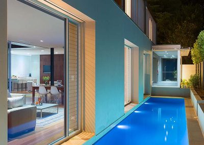 Exterior of home and pool with Breezway Louvre Windows