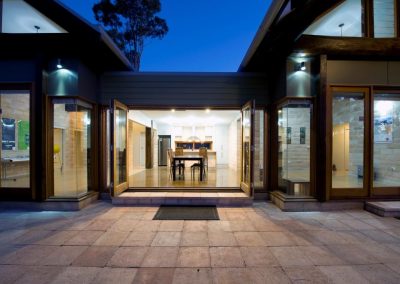 Exterior of home at sunset with Breezway Louvres