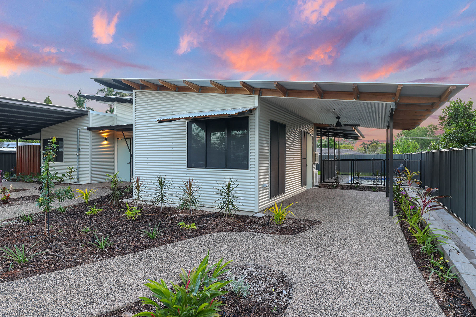 DAA Mangawhai home featuring breezway louvres overlooking pool