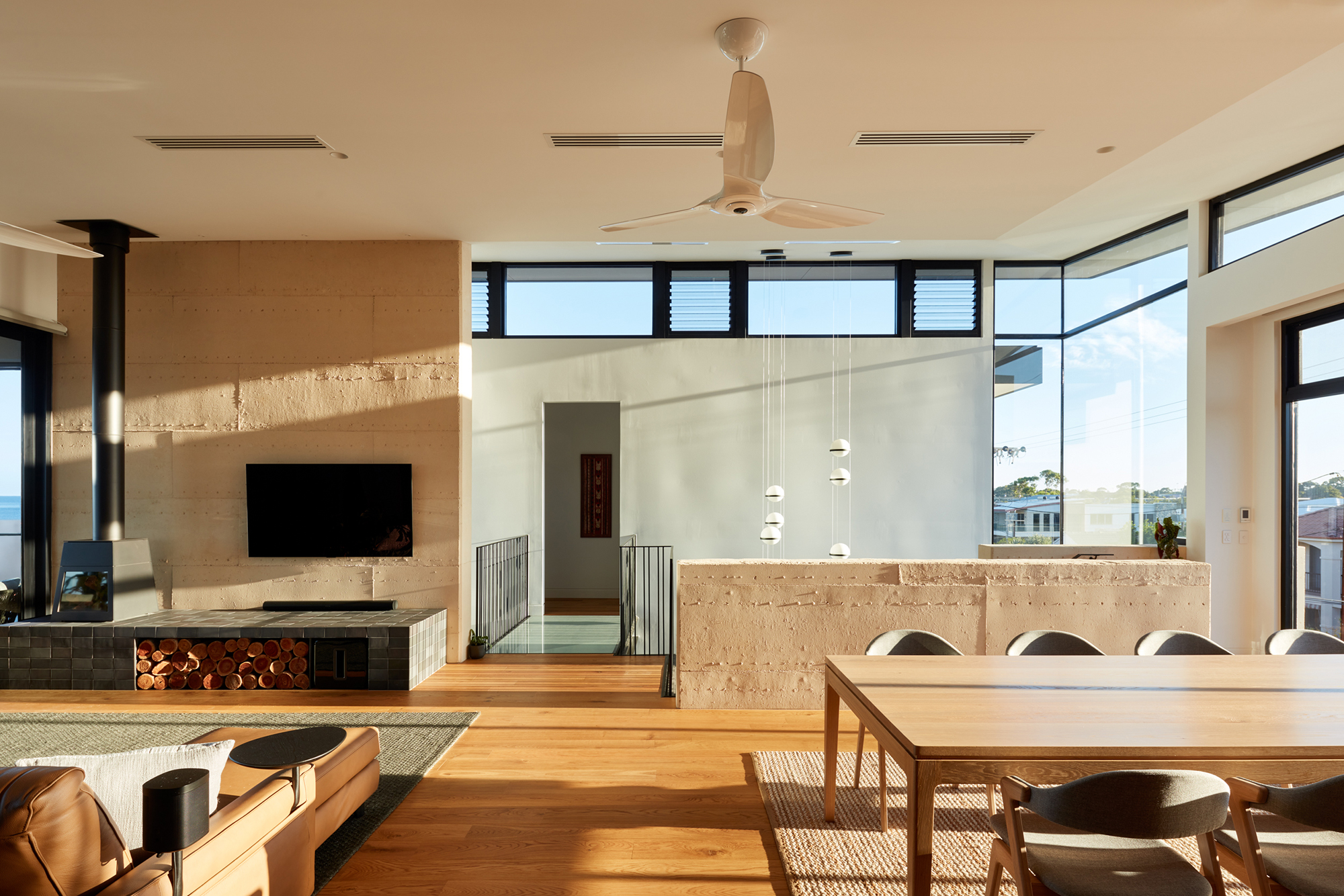 Breezway Louvres up high keep living rooms fresh and comfortable DAA Mangawhai home featuring breezway louvres overlooking pool